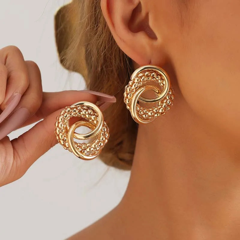 Twist Dangle Statement Earrings – Gold