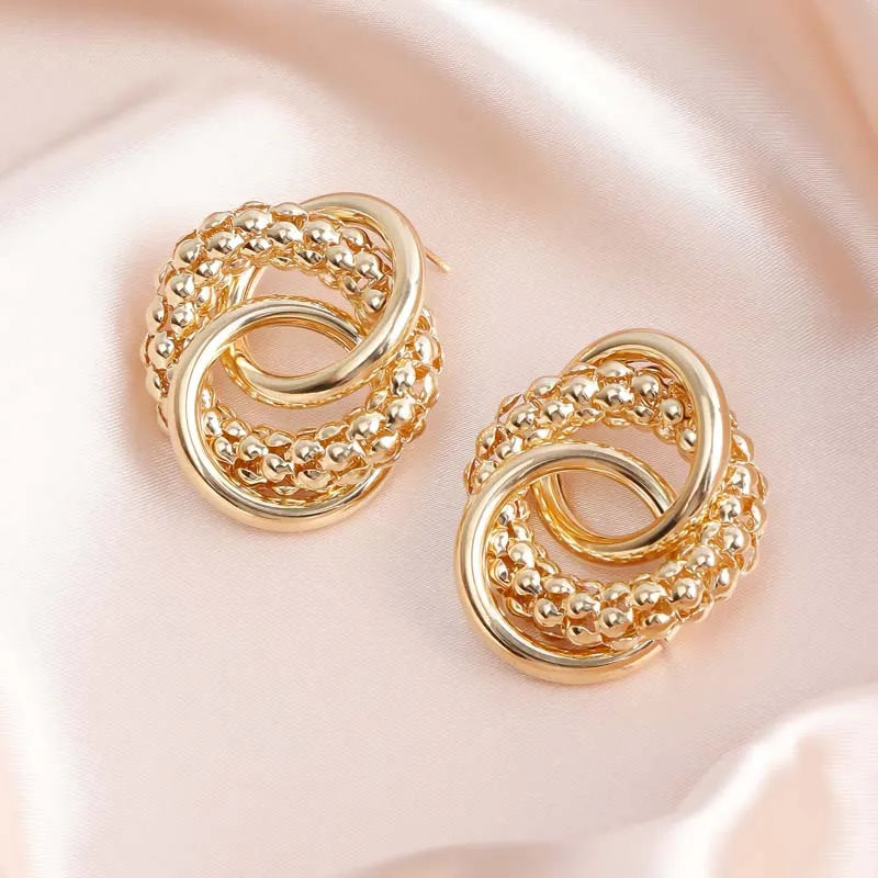 Twist Dangle Statement Earrings – Gold